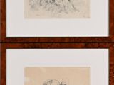 deux dessins représentant un chien et un chat, dans un cadre en bois