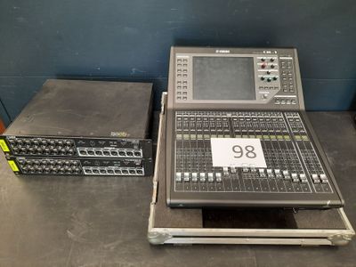 many electronic equipment sitting on a table in a room