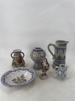 a lot of small vases and a bowl on the table