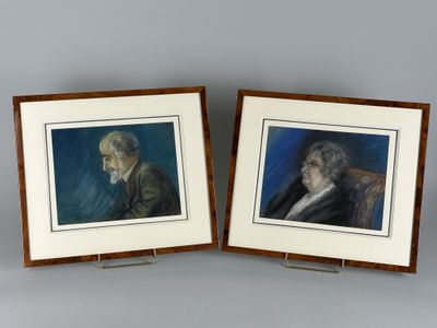 two framed portraits of two men sitting on a chair
