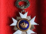 medal of the order of the crown of france in a red velvet case