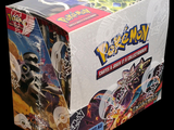 a box of pokemon trading cards on a black background