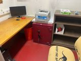a desk with a computer and a printer in a room