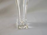 a glass vase that is sitting on a table
