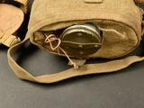 a bag with a camera inside of it on a table