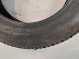 a close up of a tire on a white surface