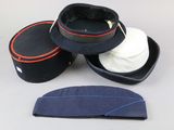 three hats sitting on top of each other on a table