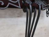 a close up of a bench with a plant on it