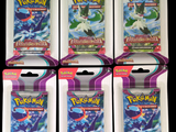 Un paquet contient quatre paquets de cartes à collectionner Pokémon