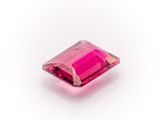 a pink tourmaline stone on a white background