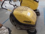 a yellow machine that is sitting on the floor