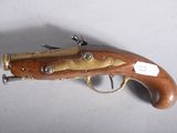 an old gun that is on display on a table
