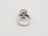 a close up of a ring on a white surface