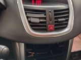 a close up of a car ' s dashboard with a clock on it