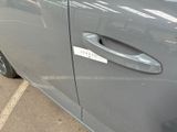 a car door handle with a sticker on it