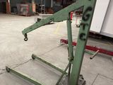 a picture of a large green machine in a warehouse