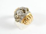 an image of a gold and diamond ring on a white surface