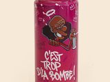 pink spray can with graffiti on it that says get trip d ' u bomb