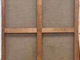 an old window with a wooden frame and a window pane on the outside