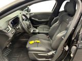 the interior of a car with a yellow sticker on the front seat