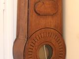 a tall wooden grandfather clock in the corner of a room