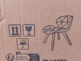 cardboard box with a picture of a chair and a cat inside of it