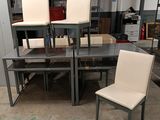 several chairs and a table in a room with a lot of furniture