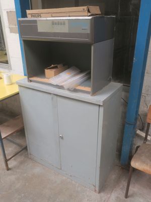a cabinet that has a bunch of boxes on top of it