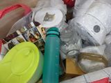 a box full of items that include a water bottle and other items