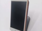 a cell phone that is sitting on top of a stand