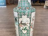 a vase that is sitting on a table in a room