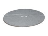 un gros plan d'un tapis circulaire posé sur une surface blanche