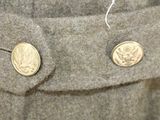 a close up of two buttons on a coat