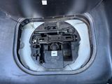 a close up of the inside of a car ' s engine compartment