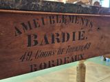 a wooden box with a sign on it that says ameulemment ' s bardiel