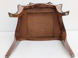 a small wooden table with a wooden frame on top of it