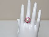 a close up of a hand with a ring on it ' s finger