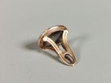 an image of a gold ring with a black stone in the middle