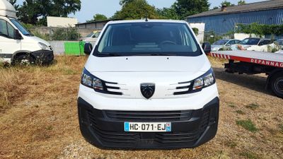 a white van that is parked in the grass