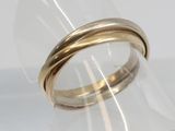 a close up of a gold ring on a clear ring holder