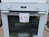 a white oven sitting on top of a cardboard box
