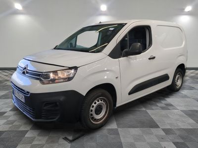 the white van is parked on a checkered tile floor