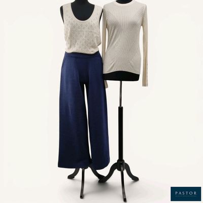 two mannequins are standing next to each other in front of a white background