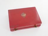 a red box that has a gold emblem on it