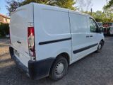 a white van that is parked in the parking lot