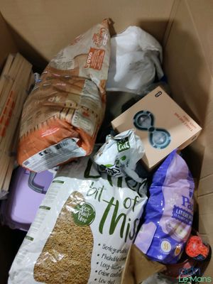 a box full of food that is sitting on the floor