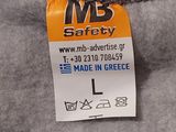 a label on the back of a sweater that says made in greece