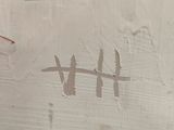 a painting of a hash mark on the side of a building