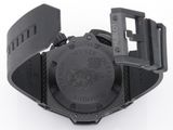 the watch is black and has a black rubber band