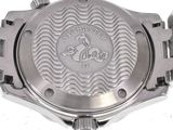 a close up of a watch on a white surface